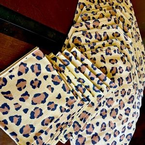 8 leopard placemats, 7 napkins